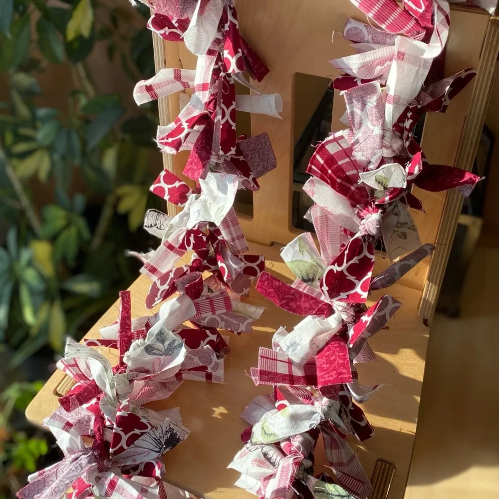 Primitive Red and White fabric garland with splashes of pink, green and black